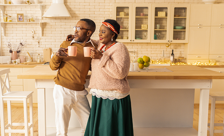couple holding coffee mugs